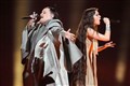 Eurovision acts perform as protesters shout at fans coming into arena