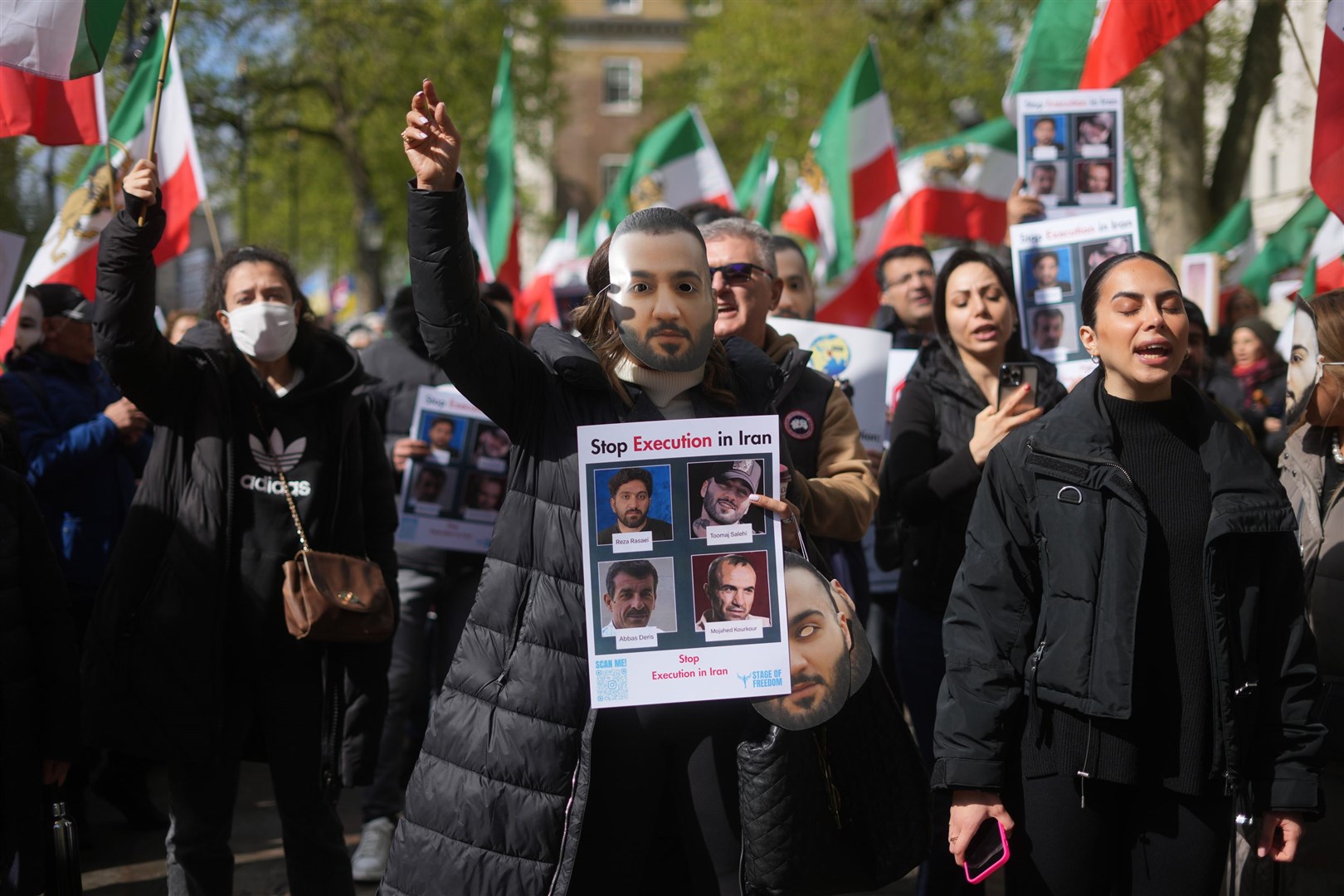 Protesters wore masks of Salehi and waved Iranian flags (Jeff Moore/PA)
