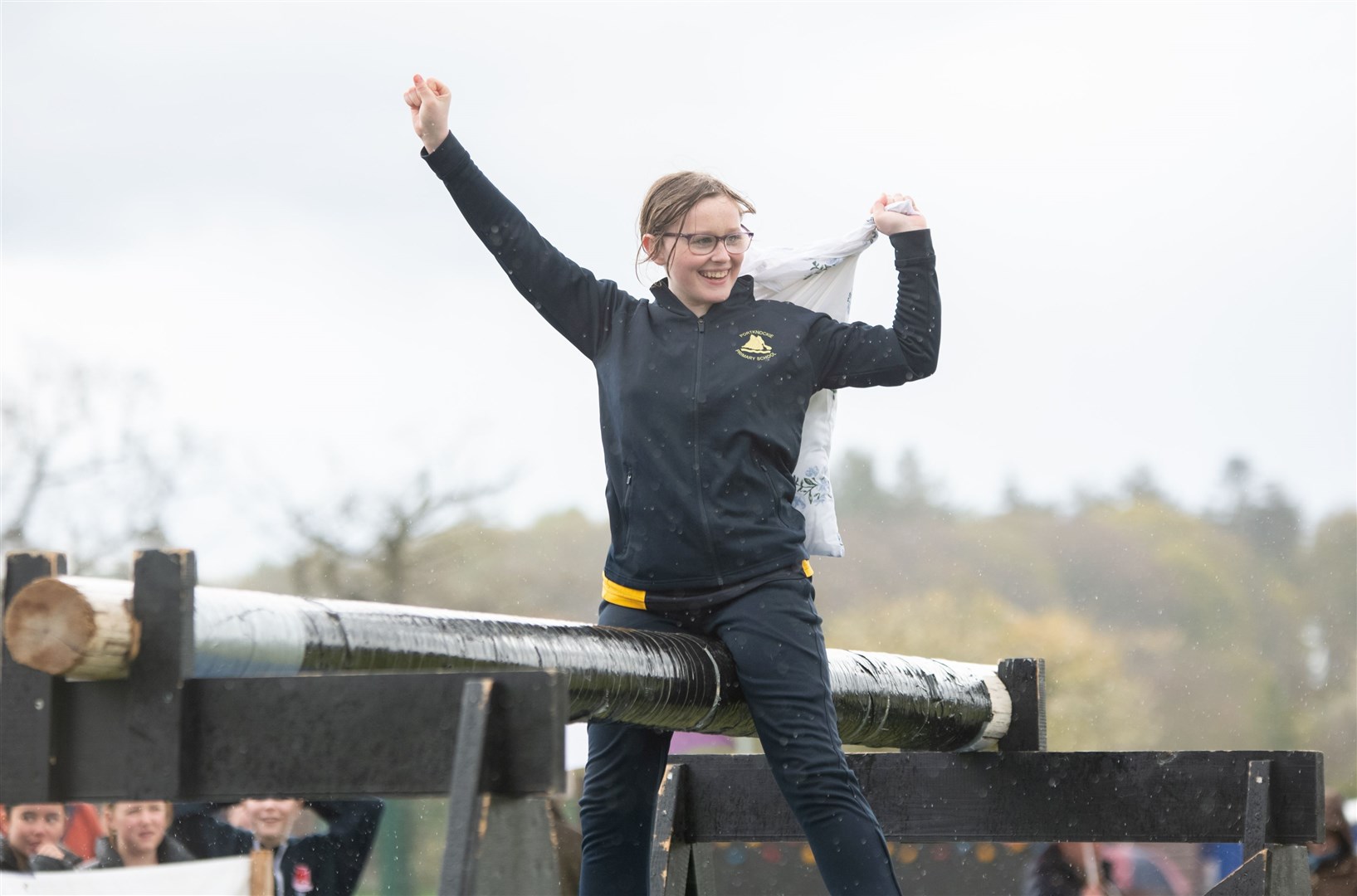 Joy for Portknockie Primary pupil Leisha Kenn, who won the slippery pole competition. Picture: Daniel Forsyth.